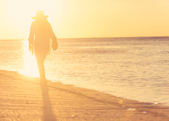 Woman walking on beach